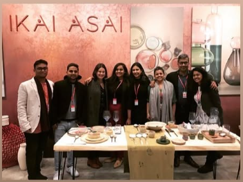 Ikai Asai trade-fair booth with team
